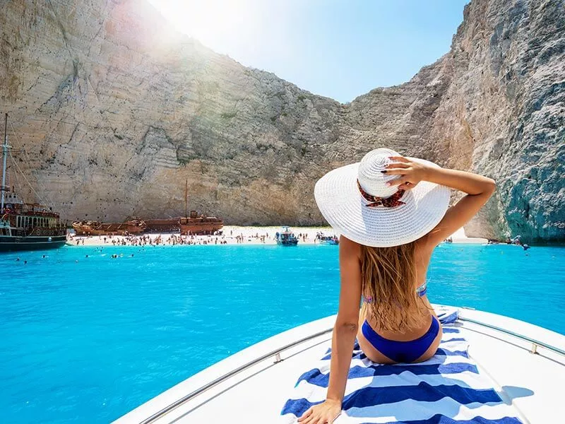 woman-sitting-in-a-cruise-overlooking-secluded-bay