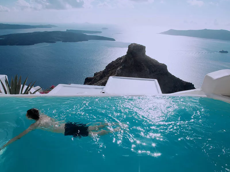 man-swimming-with-background-on-bay